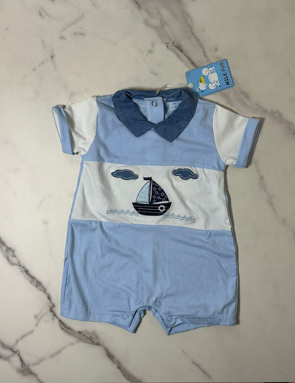 Tutina azzurra Milk Pud con stampa navetta