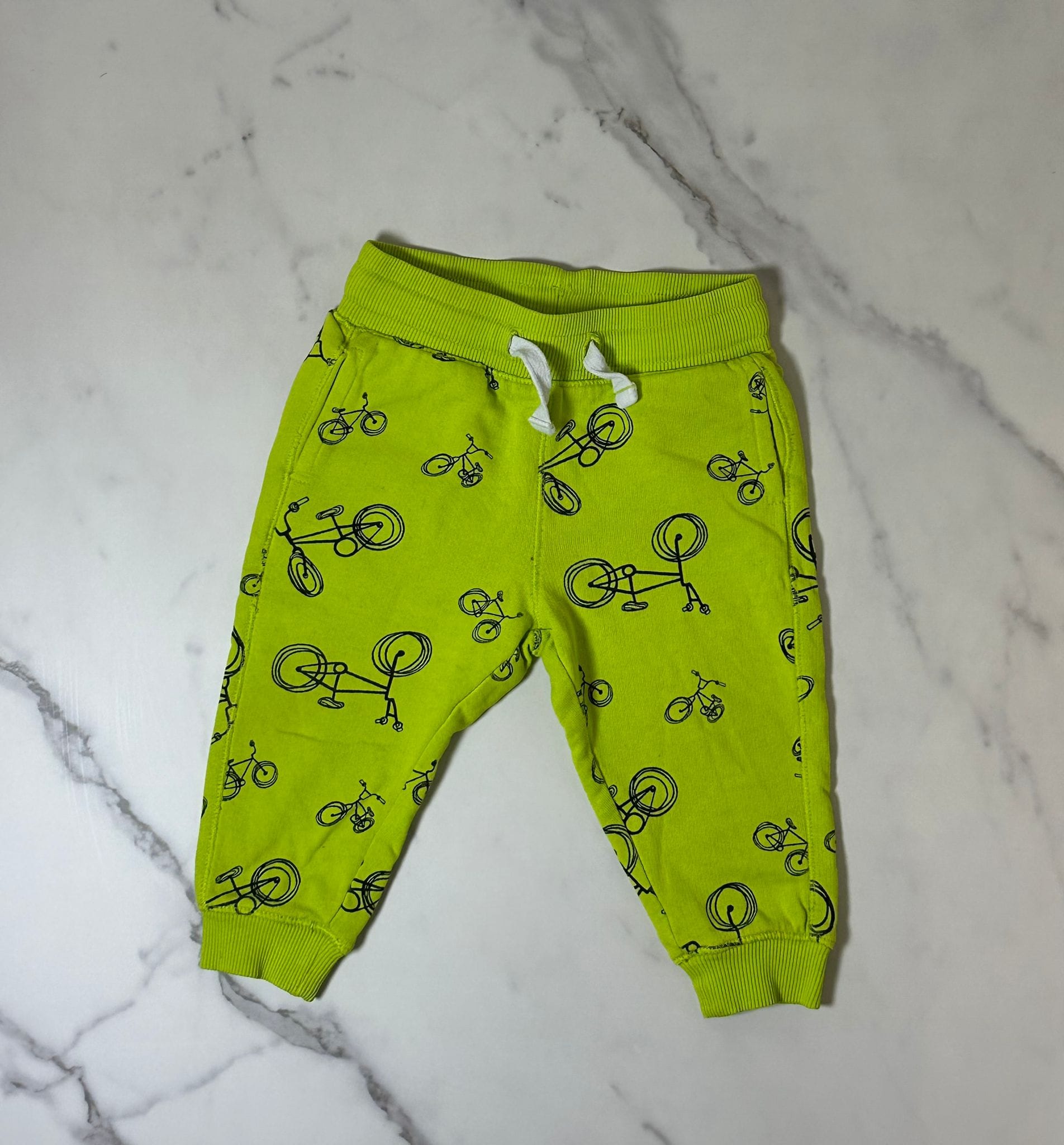 Tuta giallo fluo con biciclette Blukids